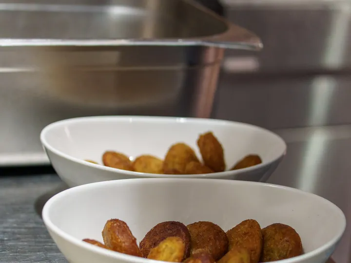 Bowls of freshly fried savoury snacks